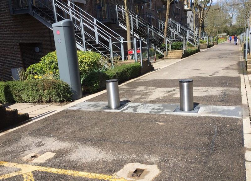 Security bollards protecting the entrance road of a university campus